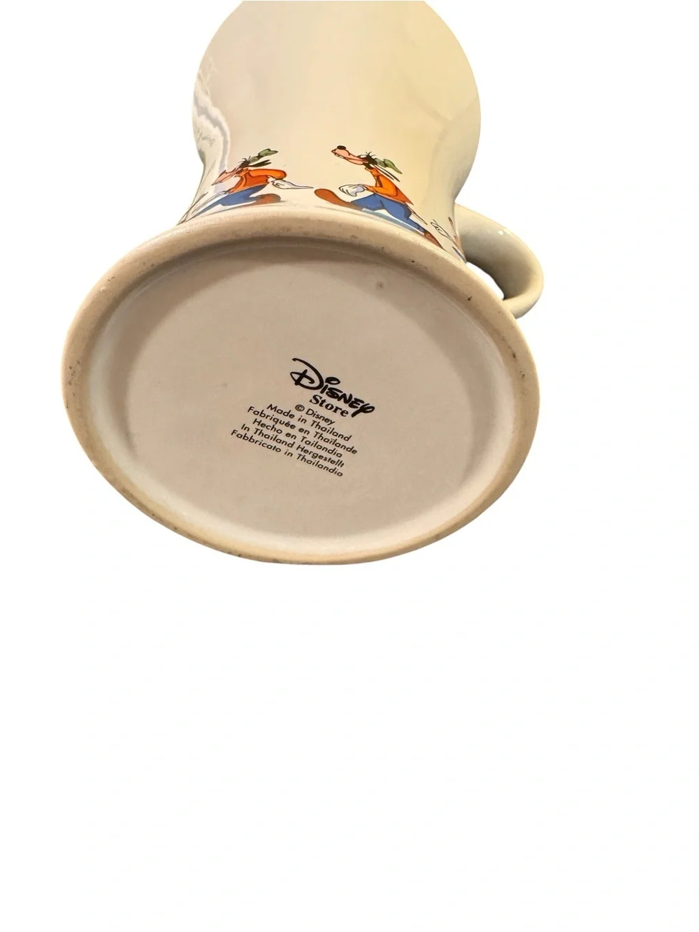 Vintage Disney store Goofy slipping on a banana peel.